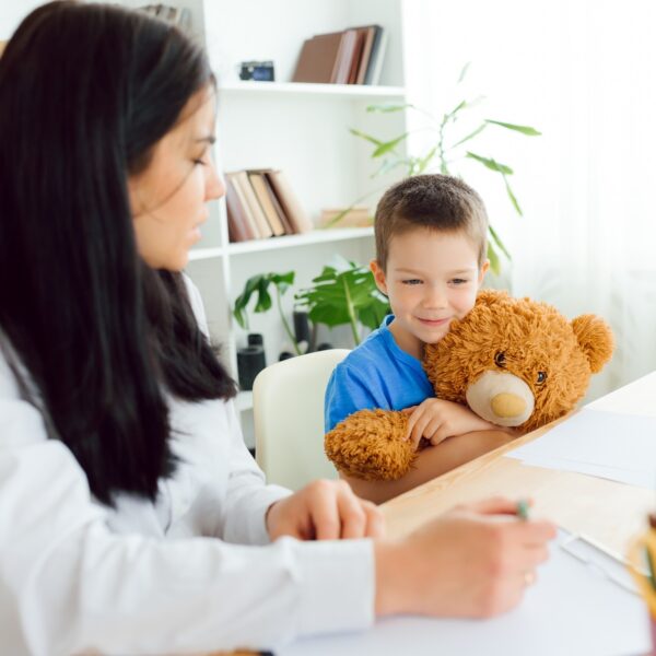 The concept of child psychology. A boy at the psychologist